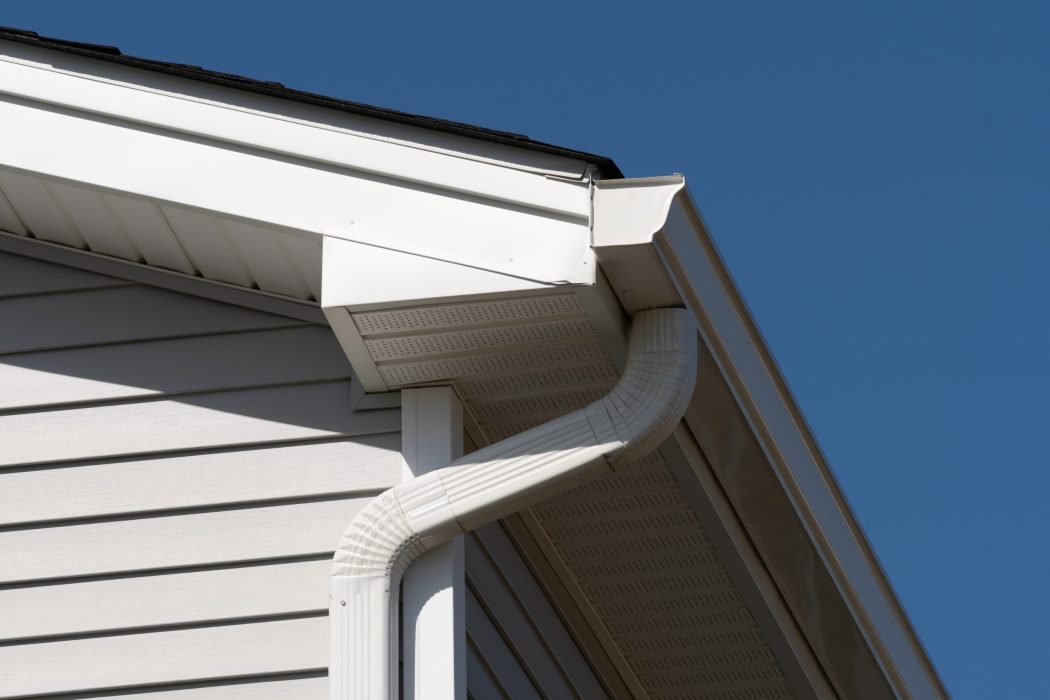 rain-gutter-roof-metal-pipe-white-facade-scaled-1.jpg